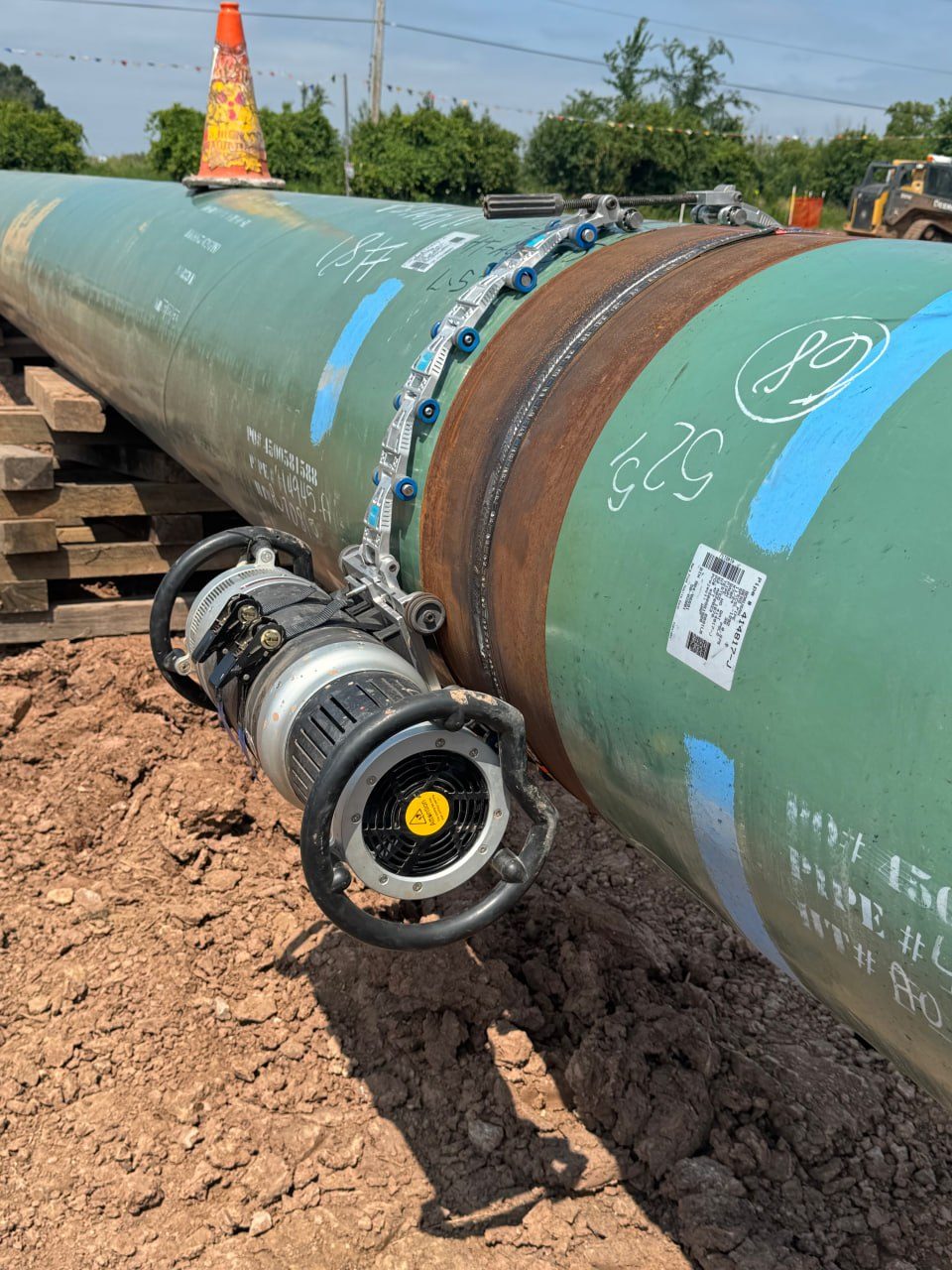 EdgeFlex radiographic (X-ray) crawler clamped on a coated pipeline girth weld